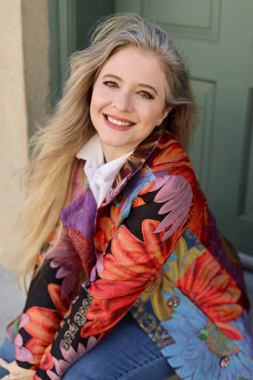Jenilyn in a floral jacket, seated headshot