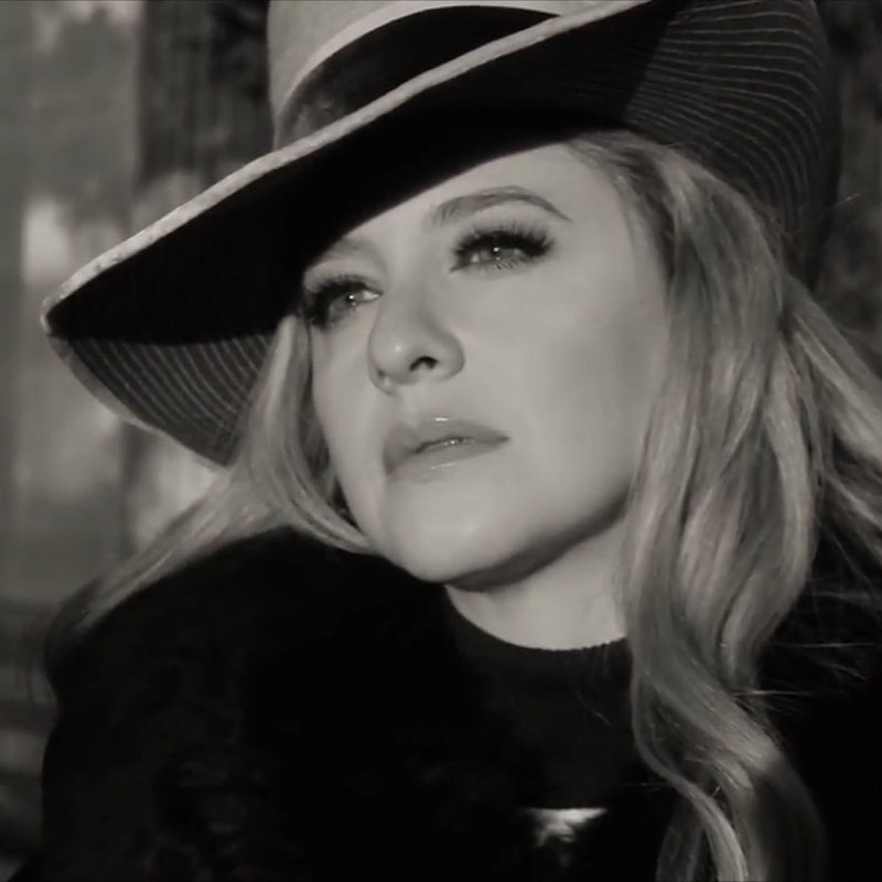 Jenilyn in a fedora, black and white film frame
